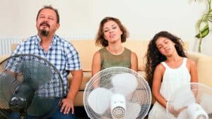 Family using fans to cool down