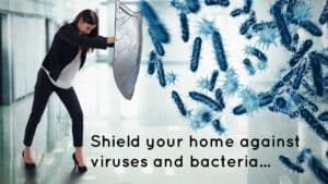 woman with shield blocking bacteria and viruses