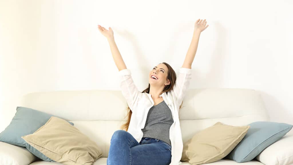 Woman happy her air conditioning is working