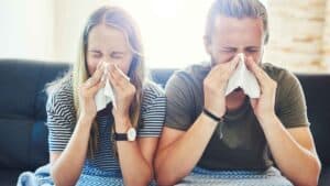 Man & woman suffering with allergies
